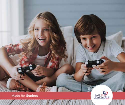 boy and girl kids playing video games on the couch